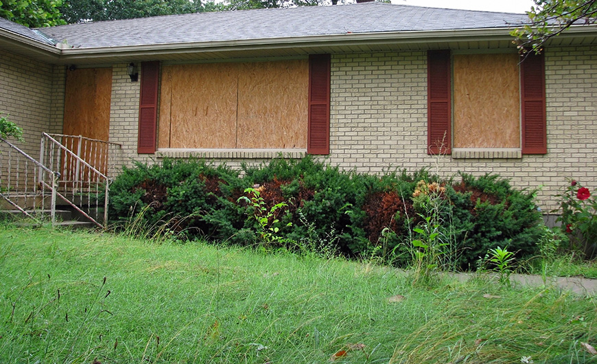 a house boarded with plywood