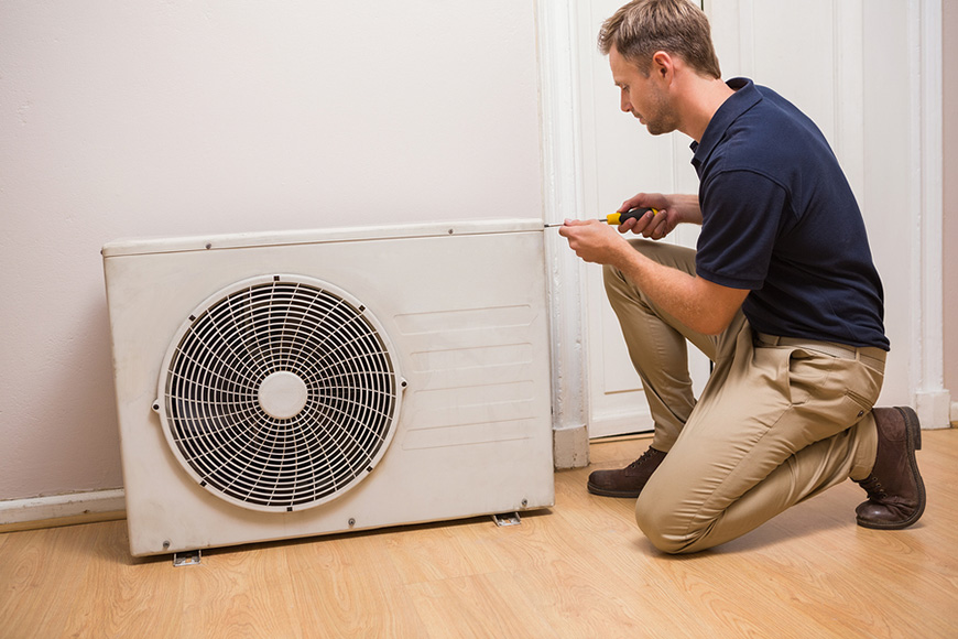 Man fixing HVAC system for home